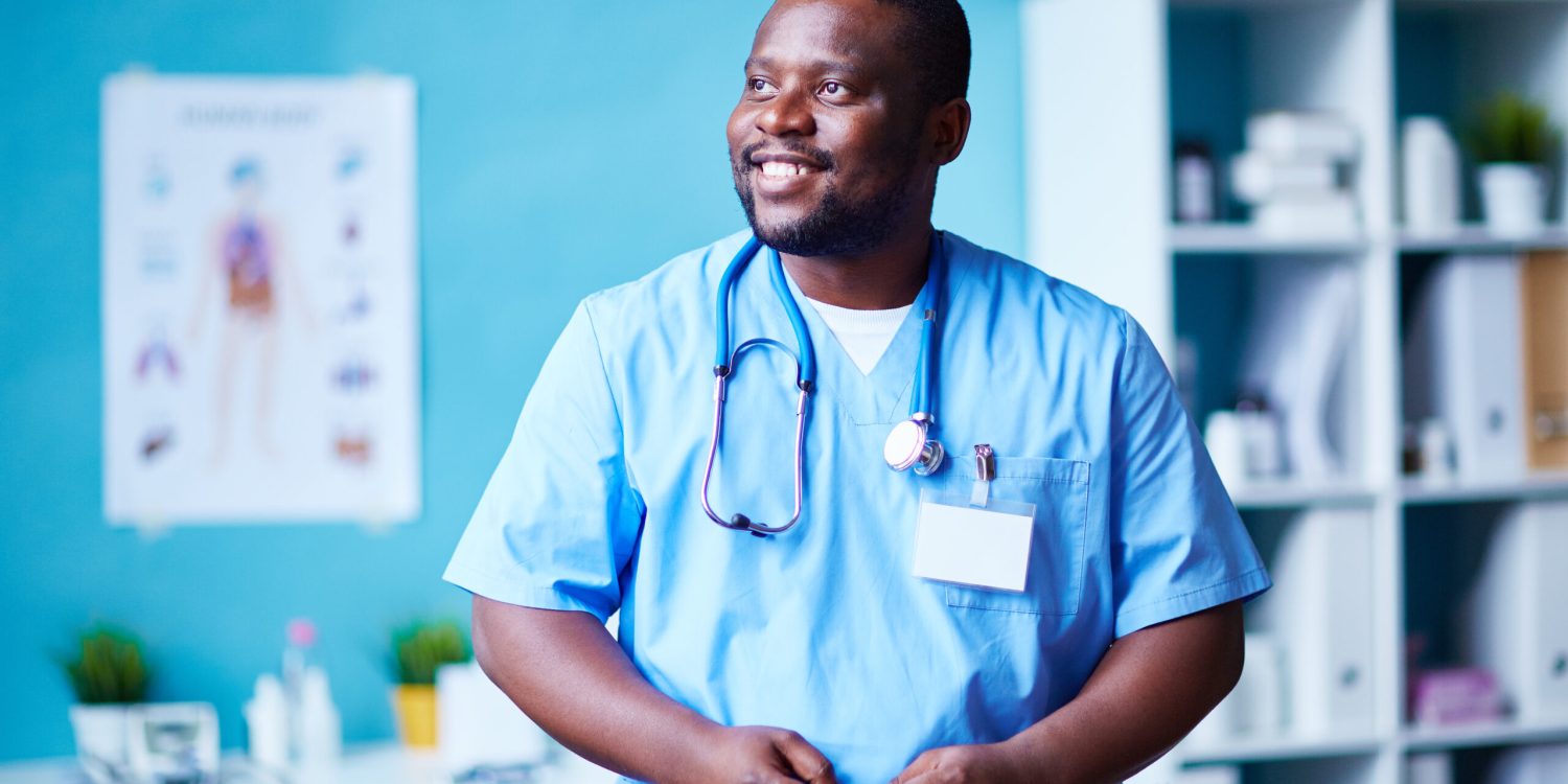 Smiling clinician in hospital